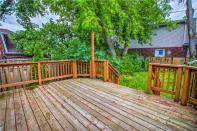 <p><span>357 O’Connor Dr., Toronto, Ont.</span><br> The backyard is fully fenced, and has a deck, perfect for entertaining.<br> (Photo: Zoocasa) </p>