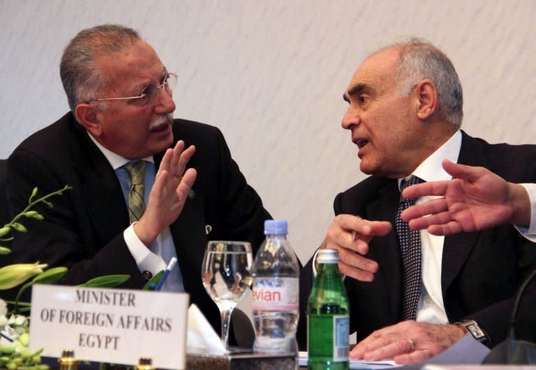 Secretary-General of the Organisation of Islamic Cooperation (OIC) Ekmeleddin Ihsanoglu (left) talks to Egyptian Foreign Affairs Minister Mohamed Kamel Amr during a meeting to prepare the OIC summit in Cairo on February 4, 2013