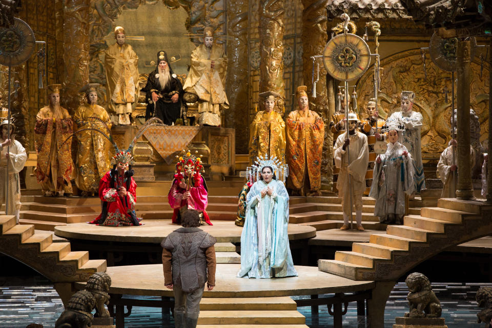 This Sept. 14, 2012, photo provided by the Metropolitan Opera shows a scene from Puccini’s “Turandot,” with Maria Guleghina , center right, in the title role, addressing Marco Berti as Calaf, foreground, during a dress rehearsal at the Metropolitan Opera in New York. (AP Photo/Metropolitan Opera, Marty Sohl)