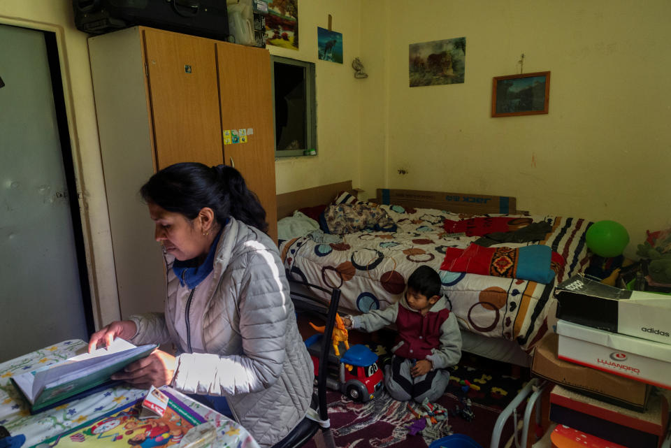 Brigida Simaniz checks the homework of her son Nicolas, 7, in her apartment in the shantytown of Bajo Flores in Buenos Aires, Argentina Aug. 19, 2019. Brigida Simaniz finished her TB treatment earlier this year in May. She works in a textile workshop on 70 pesos ($1.19) an hour and lives with her two children, all three sharing the same bed. Her fear was passing the infection to her kids. "I was scared when they told me the diagnosis because I did not know it existed. I always followed the treatment as the doctors said for fear of infecting my children," said Simaniz. "Even though it was cold at night, I opened the windows of the room to circulate the air." Cases of the "white death" illness, closely linked to poverty, malnutrition and poor housing, have been on the rise since the turn of the decade as Latin America's third largest economy has grappled with repeat recessions and inflation. (Photo: Magali Druscovich/Reuters)