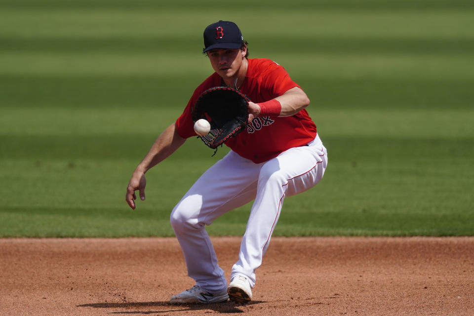 Boston Red Sox first baseman Bobby Dalbec (29) fields a ground ball from Atlanta Braves; Cristian Pache in the first inning off a spring training baseball game Wednesday, March 10, 2021, in Fort Myers, Fla.. (AP Photo/John Bazemore)