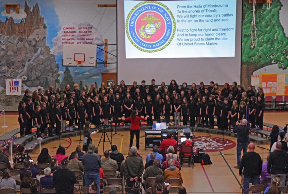 The Rochester Middle School Chorus performs for veterans and their families.