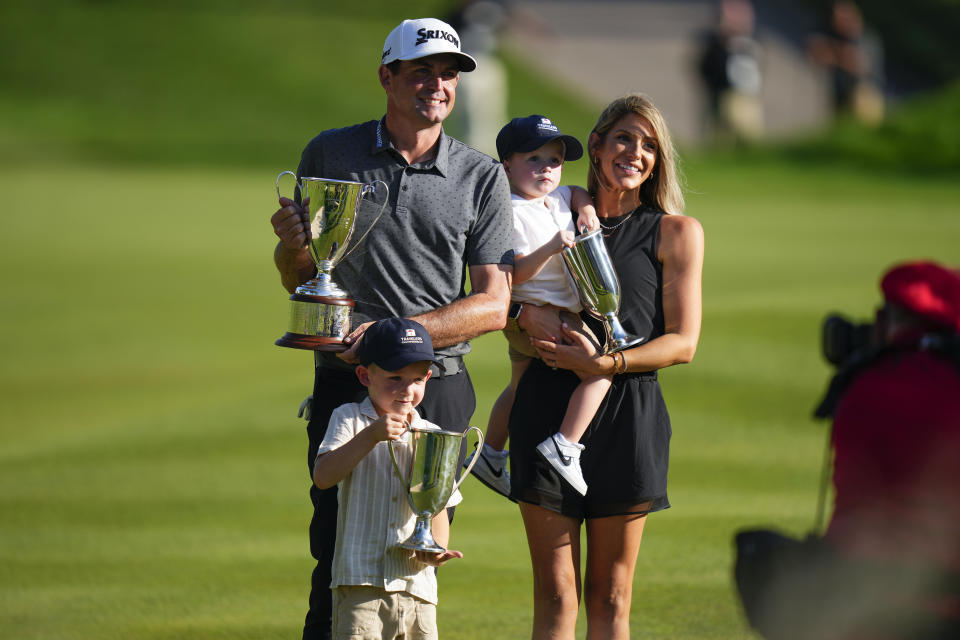 Keegan Bradley celebrates winning the Travelers Championship golf tournament with his family at TPC River Highlands, Sunday, June 25, 2023, in Cromwell, Conn. (AP Photo/Frank Franklin II)