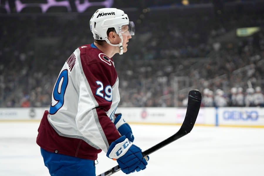 Colorado Avalanche center <span class="caas-xray-inline-tooltip"><span class="caas-xray-inline caas-xray-entity caas-xray-pill rapid-nonanchor-lt" data-entity-id="Nathan_MacKinnon" data-ylk="cid:Nathan_MacKinnon;pos:4;elmt:wiki;sec:pill-inline-entity;elm:pill-inline-text;itc:1;cat:Athlete;" tabindex="0" aria-haspopup="dialog"><a href="https://search.yahoo.com/search?p=Nathan%20MacKinnon" data-i13n="cid:Nathan_MacKinnon;pos:4;elmt:wiki;sec:pill-inline-entity;elm:pill-inline-text;itc:1;cat:Athlete;" tabindex="-1" data-ylk="slk:Nathan MacKinnon;cid:Nathan_MacKinnon;pos:4;elmt:wiki;sec:pill-inline-entity;elm:pill-inline-text;itc:1;cat:Athlete;" class="link ">Nathan MacKinnon</a></span></span> celebrates after scoring during the first period of an NHL hockey game against the Los Angeles Kings Wednesday, Oct. 11, 2023, in Los Angeles. (AP Photo/Mark J. Terrill)