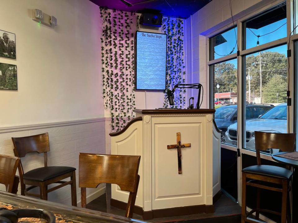 The Twelve Steps hang above a pulpit tucked in a corner at Bill and Bob’s Coffee Bar in Stallings.