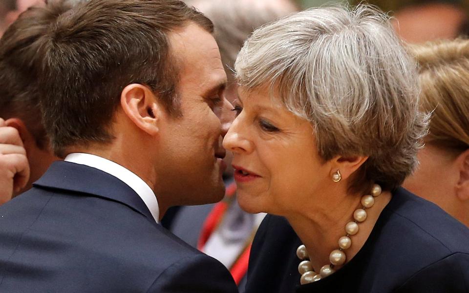 British Prime Minister Theresa May and French President Emmanuel Macron attend the EU summit in Brussels