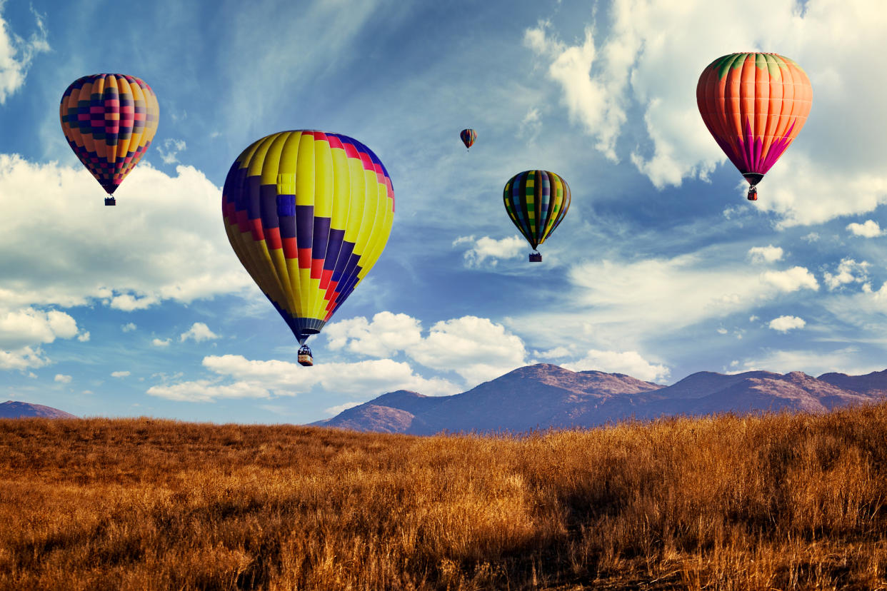  Hot air Balloons Flying over Skinner Lake in Temecula California. 