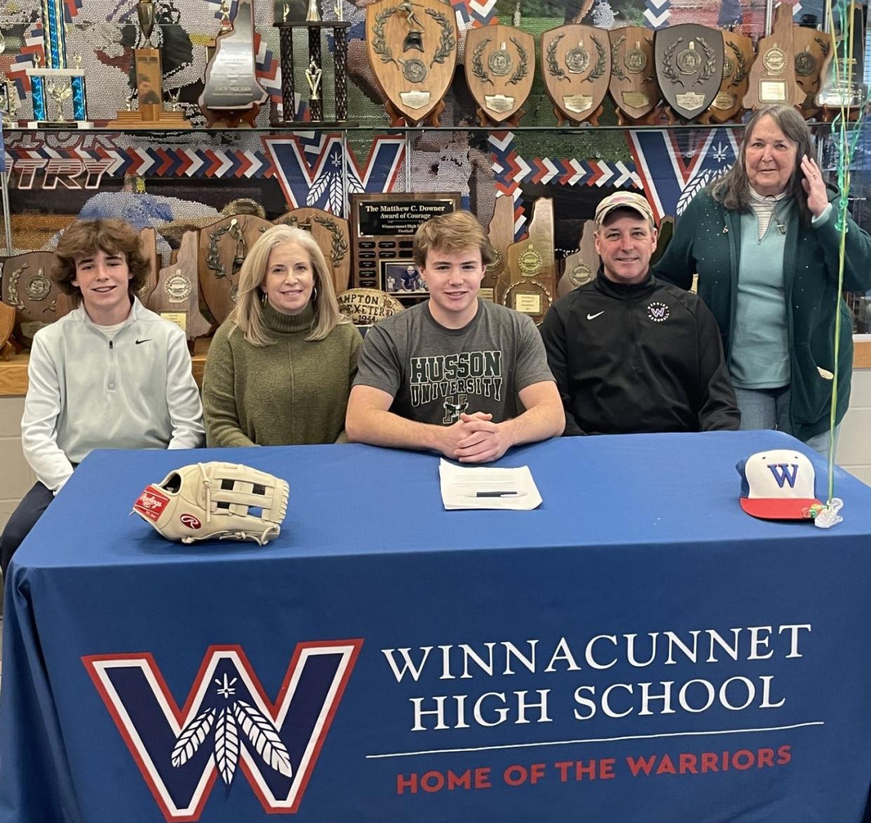 WInnacunnet High School senior Jackson Larck, center, recently announced his commitment to play baseball at Husson University. Larck his joined by his brother, Brantson; his parents, Kim and Jamie; and grandmother, Linda Larck.