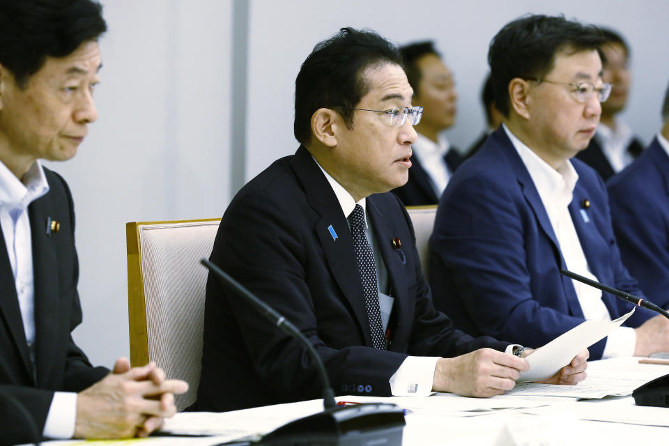 Japanese Prime Minister Fumio Kishida, center, speaks during a meeting with representatives of the Inter-Ministerial Council for Contaminated Water, Treated Water and Decommissioning Issues and the Inter-Ministerial Council Concerning the Continuous Implementation of the Basic Policy on Handling of Advanced Liquid Processing System (ALPS) Treated Water, at the prime minister's office in Tokyo Tuesday, Aug. 22, 2023. (Rodrigo Reyes Marin/Pool Photo via AP)