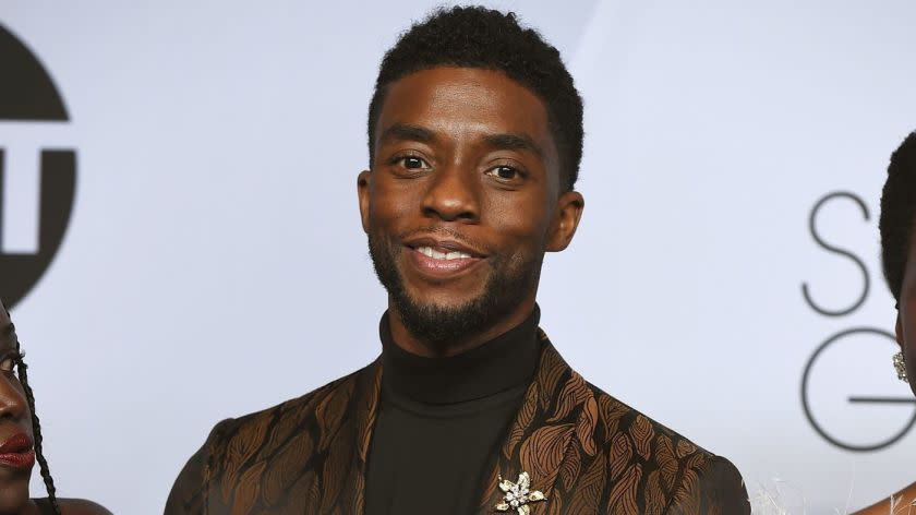 Chadwick Boseman poses with the award for outstanding performance by a cast in a motion picture for "Black Panther" in the press room at the 25th annual Screen Actors Guild Awards at the Shrine Auditorium & Expo Hall on Sunday, Jan. 27, 2019, in Los Angeles. (Photo by Jordan Strauss/Invision/AP)