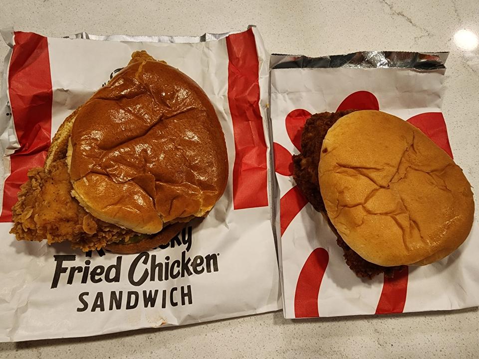 A chicken sandwich from KFC next to a chicken sandwich from Chick-fil-A