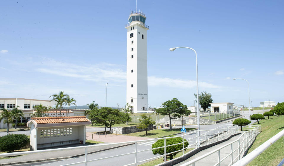 This May 24, 2018 photo made available by the U.S. Air Force shows the air traffic control tower for the Kadena Air Base airfield in Japan. The Defense Department has been figuring out how to provide help and justice when the children of service members sexually assault each other on military bases since Congress required reforms in 2018. Those reforms are starting to rollout, but as one current case at Kadena shows, that rollout has been uneven. (Staff Sgt. Jessica H. Smith/U.S. Air Force via AP)