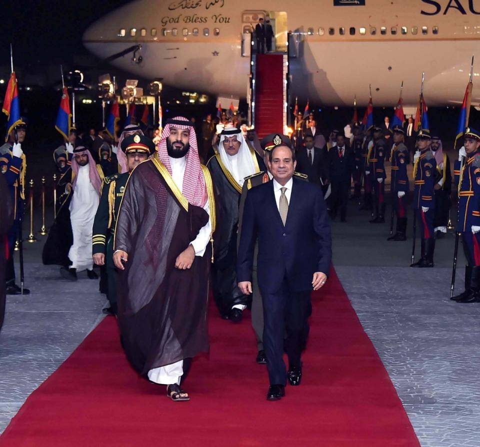 In this Monday, Nov. 26, 2018, photo released by the Egyptian Presidency's office, Saudi Arabia's Crown Prince Mohammed bin Salman is received bye Egyptian President Abdel-Fattah El-Sissi in Cairo. (Egyptian Presidency via AP)