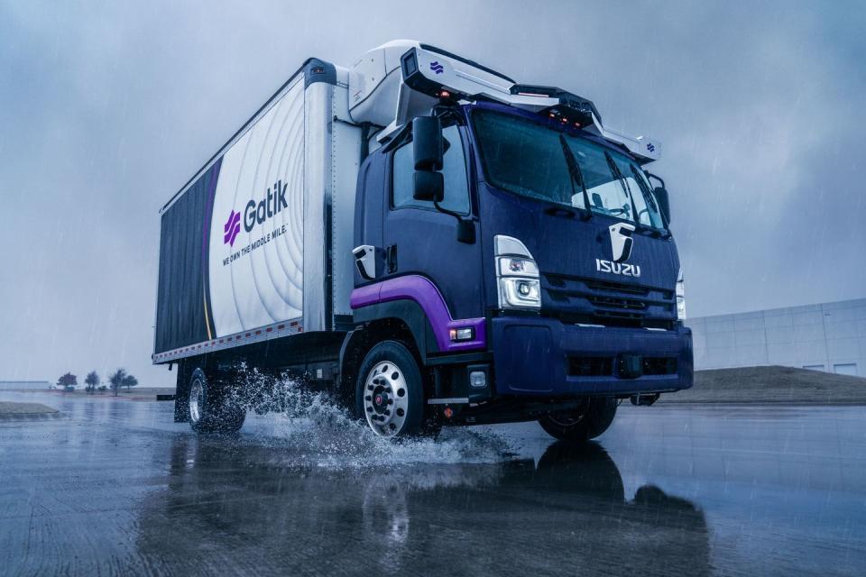 a truck driving on a wet road