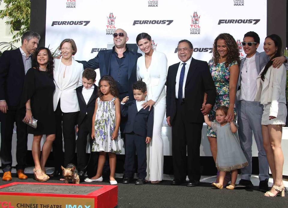 <p>WENN RIghts Ltd / Alamy</p> Vin Diesel with his family at his hand-print and foot-print ceremony in 2015