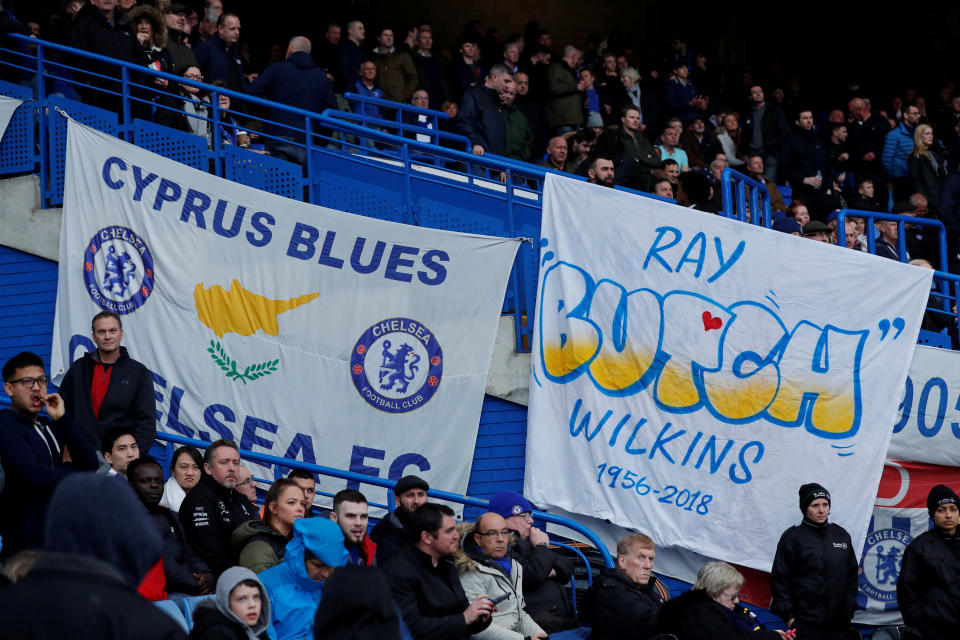 <p>Chelsea fans with a banner in memory of Ray Wilkins at an emotional Stamford Bridge </p>