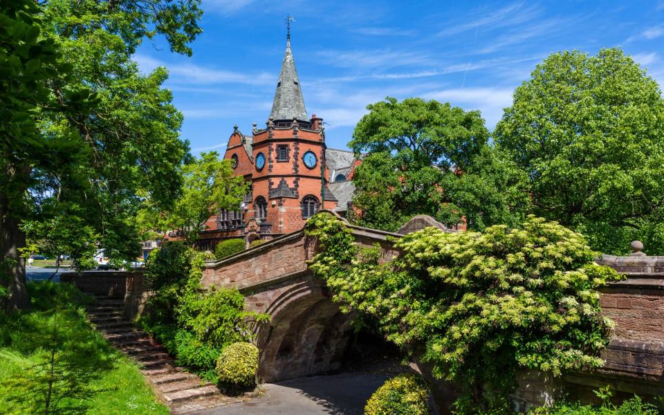 The Dell Bridge, a Grade II listed structure designed by Chester architectural firm Douglas and Fordham, with the Lyceum in the background