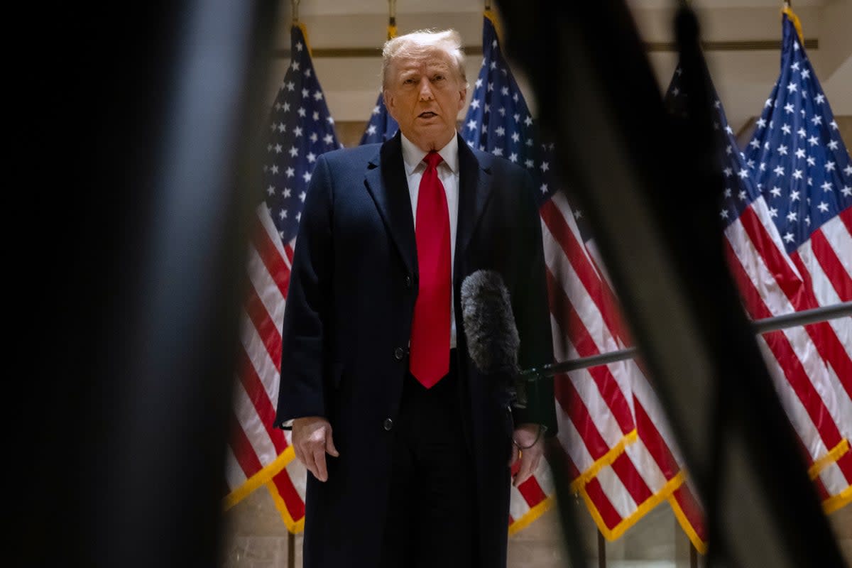 Donald Trump speaks to reporters after appearing in federal court for a defamation lawsuit on 17 January.  (Getty Images)