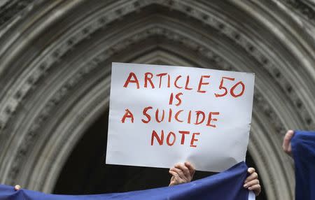 Demonstrators stand outside the High Court during a legal challenge to force the British government to seek parliamentary approval before starting the formal process of leaving the European Union, in London, Britain, October 13, 2016. REUTERS/Toby Melville