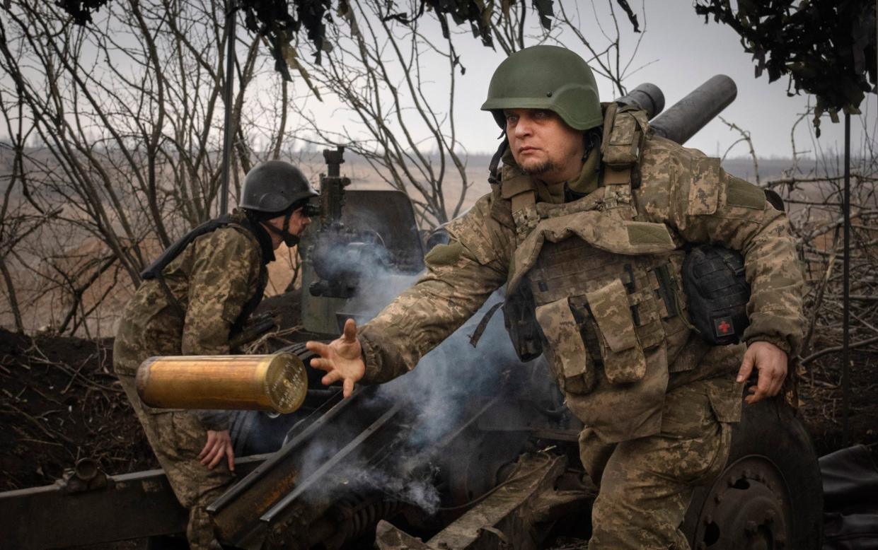 Ukrainian soldiers with the 71st Jaeger Brigade fire a M101 howitzer at Russian positions on the front line, near the city of Avdiivka in Ukraine's Donetsk region, on March 22, 2024. Approval by the U.S. House of a $61 billion package for Ukraine puts the country a step closer to getting an infusion of new firepower. But the clock is ticking. Russia is using all its might to achieve its most significant gains since the invasion by a May 9 deadline.