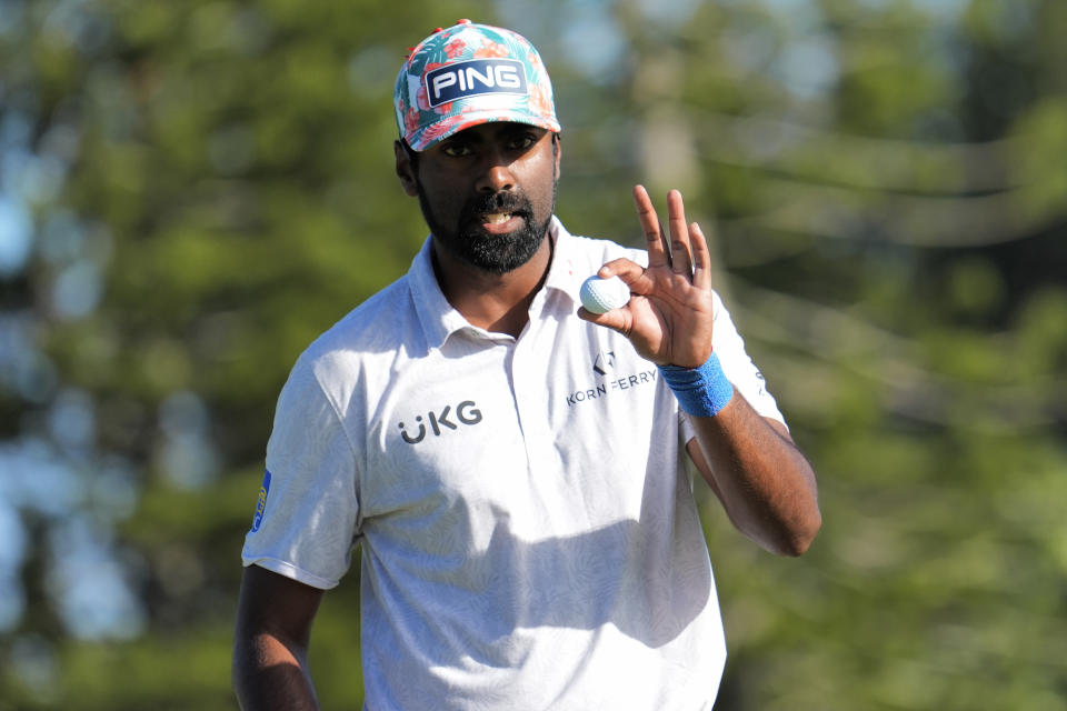 Sahith Theegala waves on the second green during the final round of The Sentry golf event, Sunday, Jan. 7, 2024, at Kapalua Plantation Course in Kapalua, Hawaii. (AP Photo/Matt York)