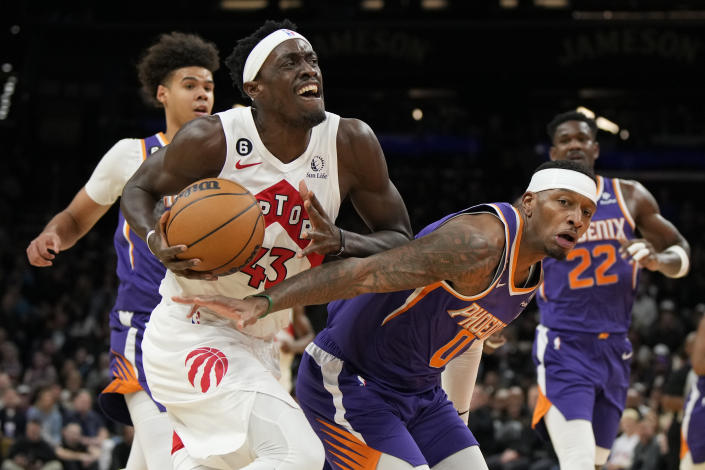 Toronto Raptors forward Pascal Siakam (43) drives past Phoenix Suns forward Torrey Craig (0) during the first half of an NBA basketball game, Monday, Jan. 30, 2023, in Phoenix. (AP Photo/Rick Scuteri)
