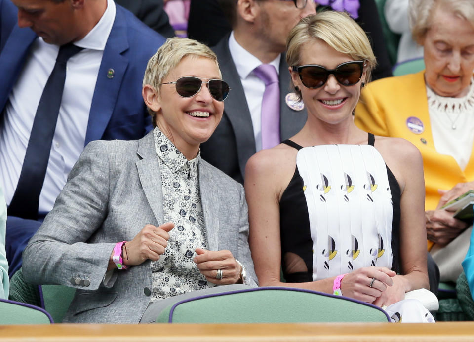 Ellen DeGeneres, left, and her wife Portia de Rossi sit in the Royal Box on day thirteen of the Wimbledon Tennis Championships in London, Saturday, July 9, 2016. (AP Photo/Tim Ireland)