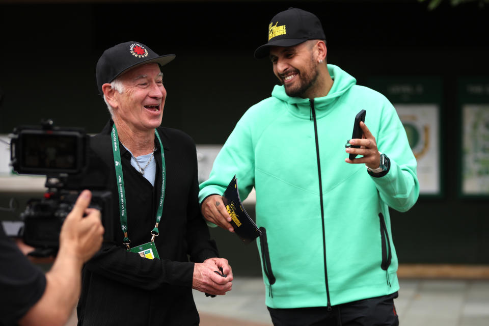 John McEnroe and Nick Kyrgios share a laugh.