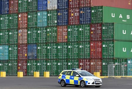 FILE PHOTO: British port police patrol as the largest container ship in world, CSCL Globe, docks during maiden voyage, at the port of Felixstowe in south east England.