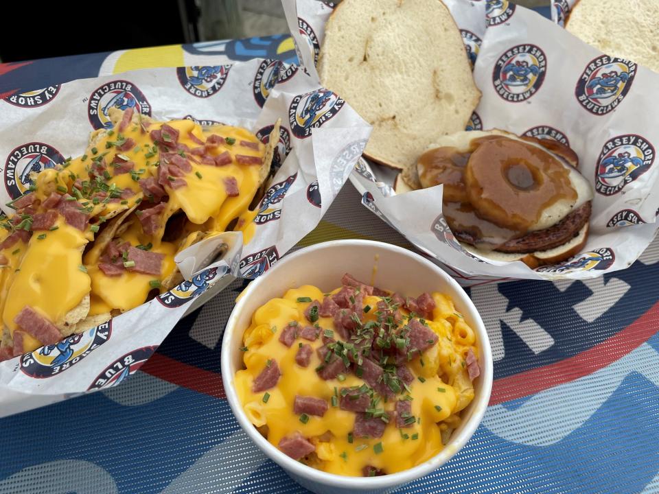 Menu items from the new Taylor Pork Roll Boardwalk Eats stand at ShoreTown Ballpark in Lakewood include pork roll-topped nachos, a pork roll and cheese sandwich with pineapple and teriyaki sauce, and macaroni and cheese with pork roll.