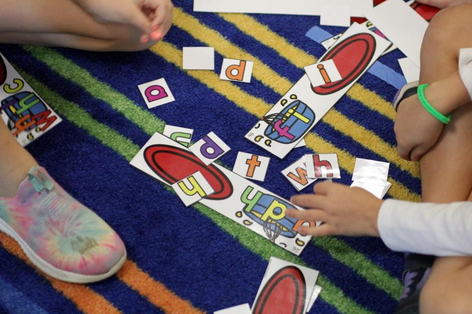 Students work on a phonics activity during center time in Heather Miller’s classroom.