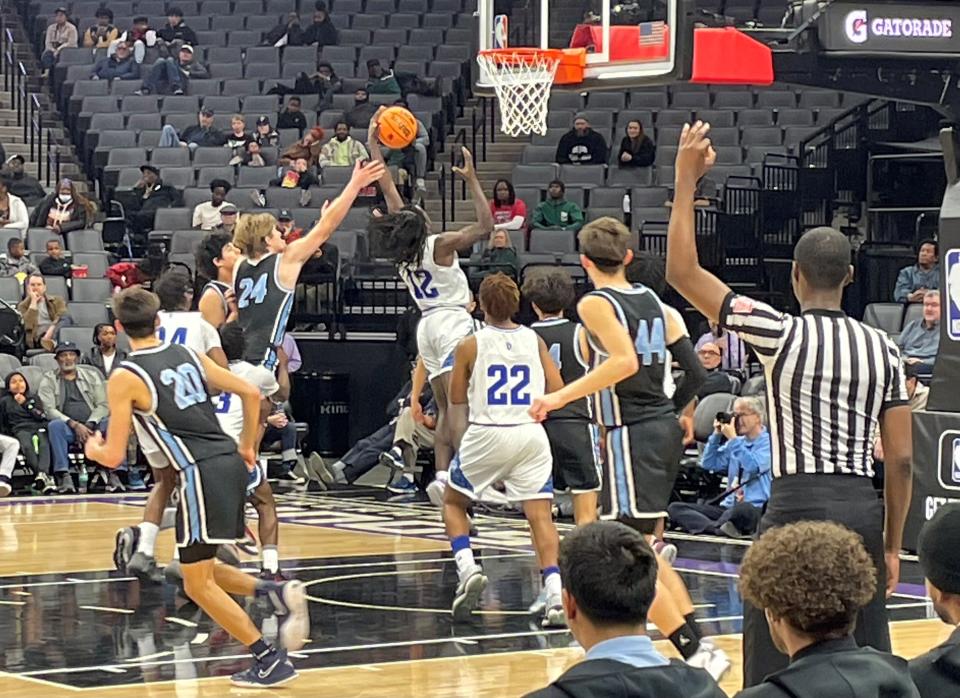 Buena's Zane Carter (24) goes for a rebound during the Bulldogs' 59-43 loss to Oakland High on Friday in the CIF-State Division III state championship game at the Golden 1 Center in Sacramento.