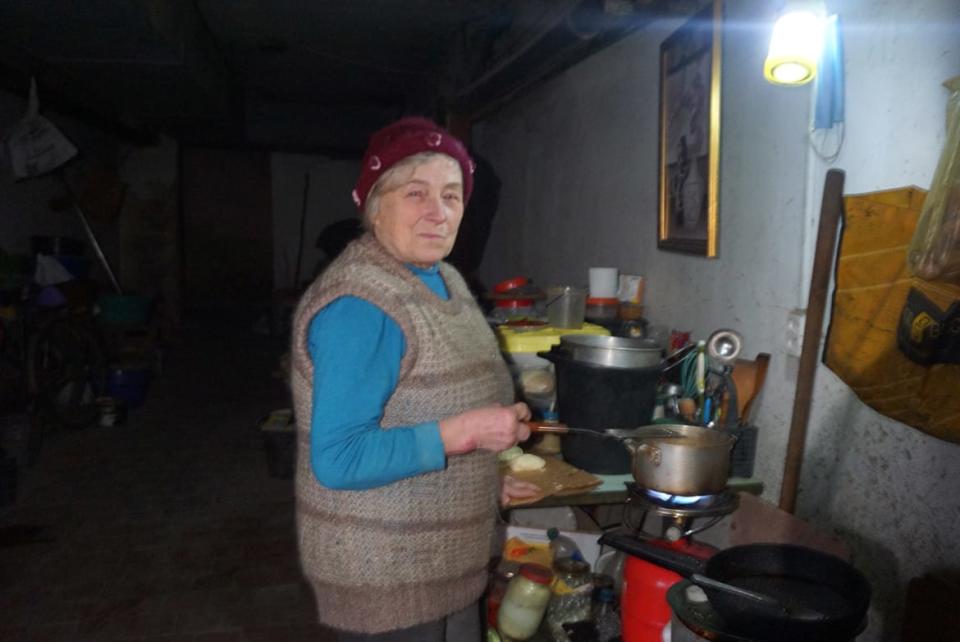 <div class="inline-image__caption"><p>Olena Altabar cooks over a makeshift gas stove.</p></div> <div class="inline-image__credit">Anna Conkling</div>