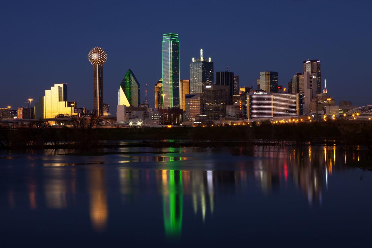 Downtowwn Dallas, Texas at night with the Trinity River in the forground