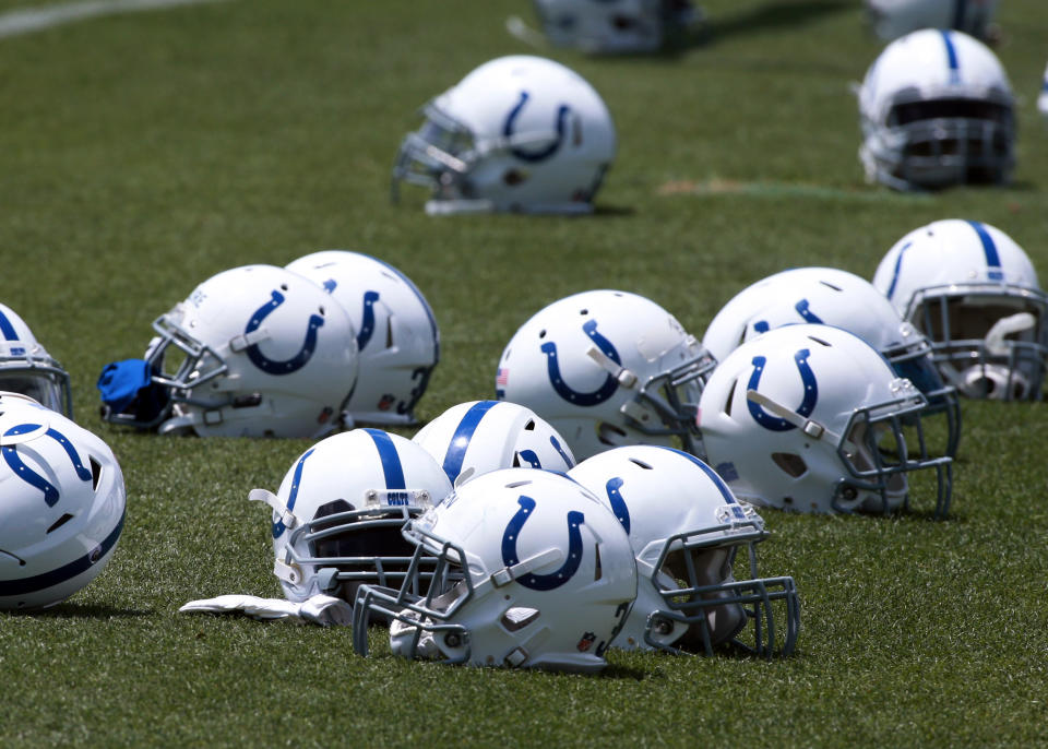 Jun 7, 2016; Indianapolis, IN, USA; Indianapolis Colts lay their helmets on the field as they stretch during mini camp at the Indiana Farm Bureau Center. Mandatory Credit: Brian Spurlock-USA TODAY Sports
