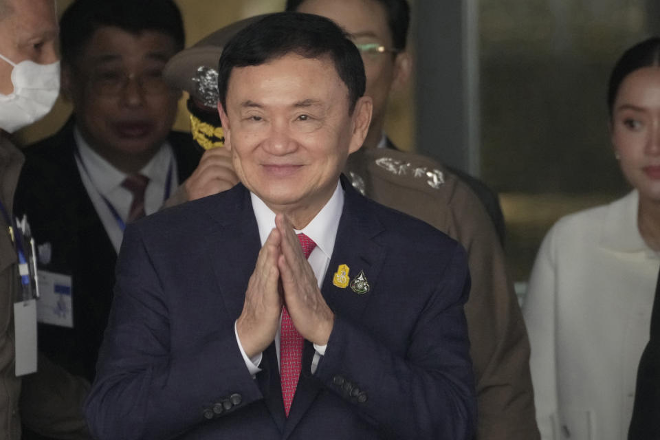 FILE - Thailand's former Prime Minister Thaksin Shinawatra, center, with his son Phantongtae and his daughter Pinthongta, arrives at Don Muang airport in Bangkok, Thailand, Tuesday, Aug. 22, 2023. Thaksin Shinawatra, a controversial former Prime Minister of Thailand, made his dramatic return to Thailand last year after nearly a decade of self-imposed exile. Although he was detained in a hospital and never appeared in the public eye for six months after his arrival, his presence in the country alone brings a turmoil into Thai politics like no other politician could ever achieve. (AP Photo/Sakchai Lalit,File)