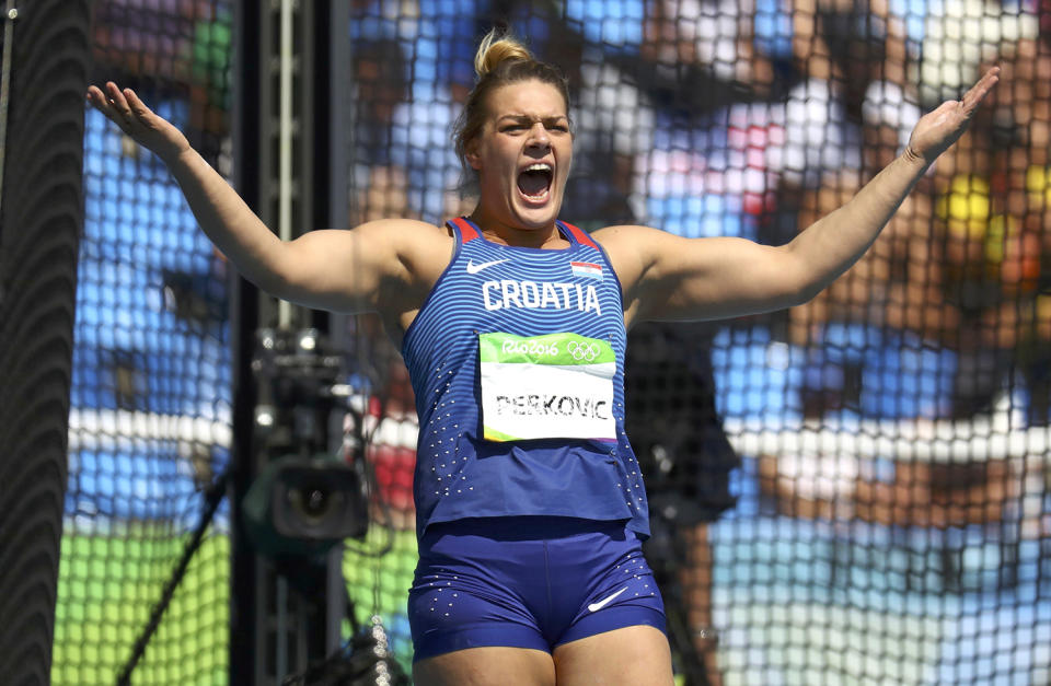 <p>Sandra Perkovic of Croatia reacts after winning gold in the women’s discus throw final at the Olympic Stadium in Rio on August 16, 2016. (REUTERS/Kai Pfaffenbach) </p>