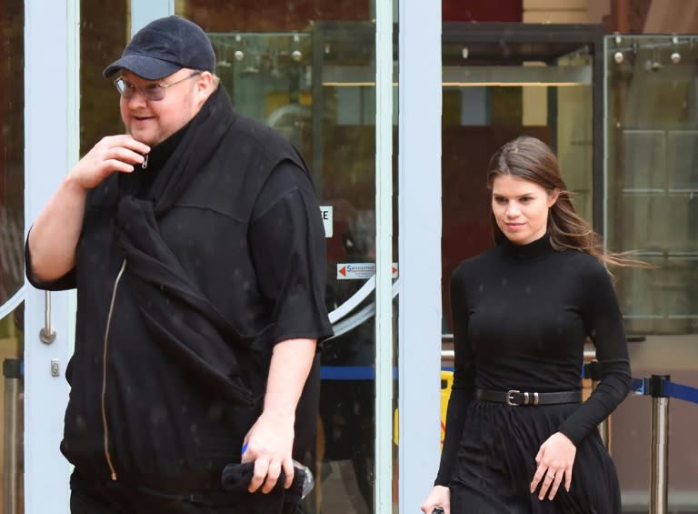 Internet mogul Kim Dotcom leaves with his girlfriend Elizabeth Donelly following his extradition appeal at the High Court in Auckland on August 29, 2016