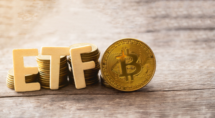 Bitcoin coin with ETF text Put on wooden floor, Concept Entering the Digital Money Fund. Bitcoin ETF