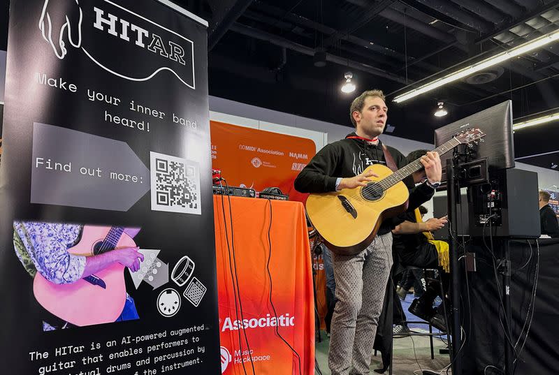 Andrea Martelloni demonstrates the 'HITar', an AI-powered augmented guitar at the 2024 National Association of Music Merchants (NAMM) trade show in Anaheim