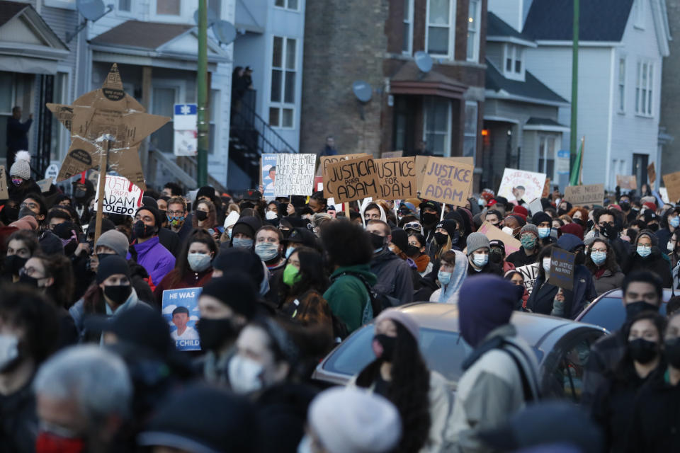 Demonstrators protest the shooting of 13-year-old Adam Toledo, Friday, April 16, 2021, in Logan Park in Chicago. (AP Photo/Shafkat Anowar)