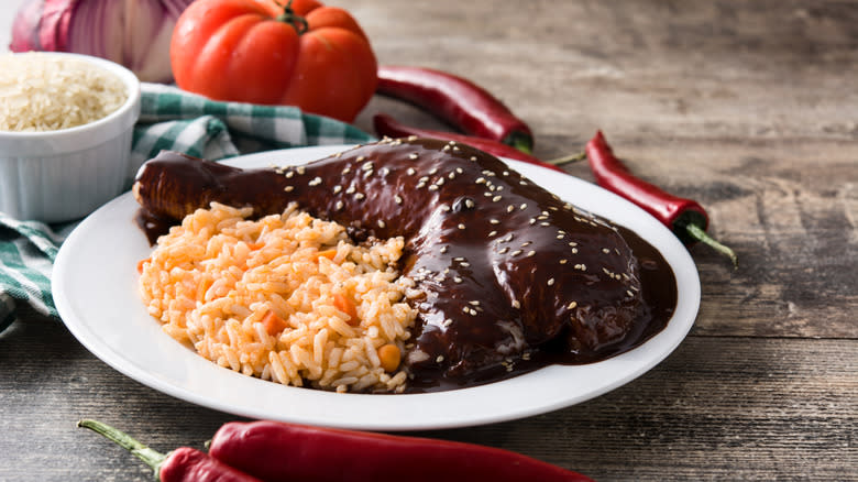 dark mole sauce over chicken