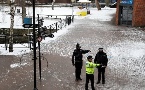 Officers at the cordon near the tent covering the bench where Sergei Skripal and his daughter were found poisoned - Credit: REUTERS/Peter Nicholls