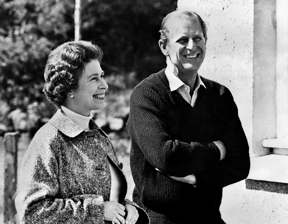 Britain's Queen Elizabeth II and Prince Philip, Duke of Edinburgh, pose at Balmoral Castle, near the village of Crathie in Aberdeenshire, on October 31, 1972. (Photo by - / CENTRAL PRESS / AFP) (Photo by -/CENTRAL PRESS/AFP via Getty Images)