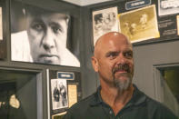 In this photo provided by the National Baseball Hall of Fame and Museum, Larry Walker tours of the of the National Baseball Hall of Fame and Museum, Tuesday, Feb. 25, 2020, in Cooperstown, N.Y. Walker said on Tuesday that his Hall of Fame plaque will show him in Colorado Rockies cap, not a Montreal Expos hat. He added the key to picking the Rockies is that Colorado was "where the majority of my damage was done." (Milo Stewart, Jr./National Baseball Hall of Fame and Museum via AP)