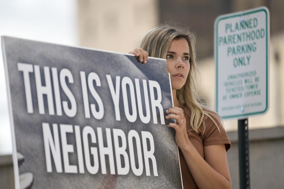 Isabel Patrick protests outside Planned Parenthood, Monday, Sept. 18, 2023, in Milwaukee. (AP Photo/Morry Gash)