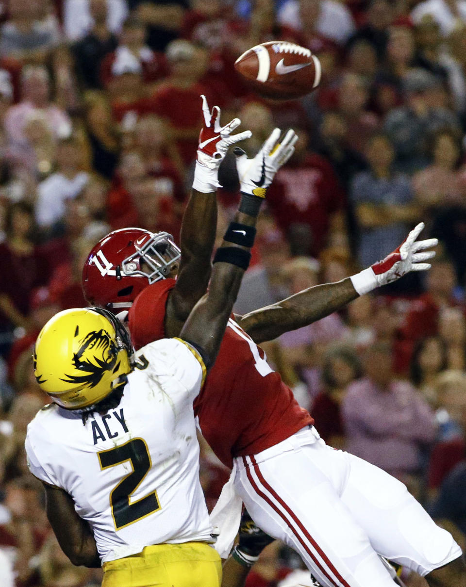 Missouri defensive back DeMarkus Acy (2) breaks up a pass intended for Alabama wide receiver Henry Ruggs III (11) in the end zone during the first half of an NCAA college football game Saturday, Oct. 13, 2018, in Tuscaloosa, Ala. (AP Photo/Butch Dill)