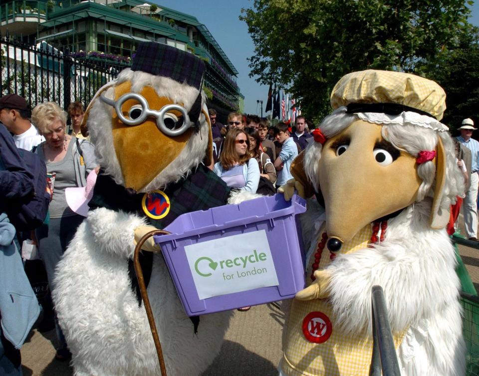 The Wombles hold a recycling box during the 2005 Wimbledon Championships.