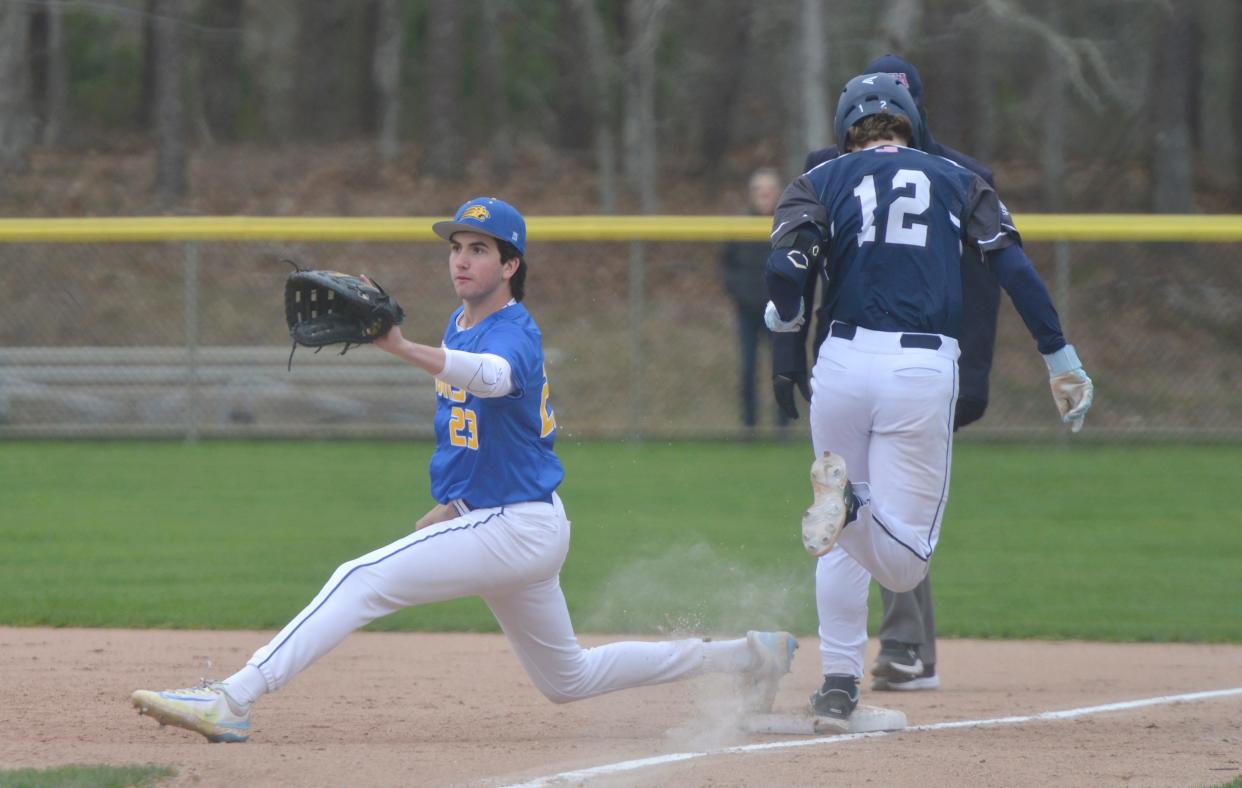 HARWICH -- 04/17/24 -- Monomoy's Finn Hyora, right, makes it safely to first base manned by St. John Paul II's Brian Mancinelli in first inning action. 
Monomoy Regional High School hosted St. John Paul II School in baseball action Thursday morning in Harwich. 
Merrily Cassidy/Cape Cod Times