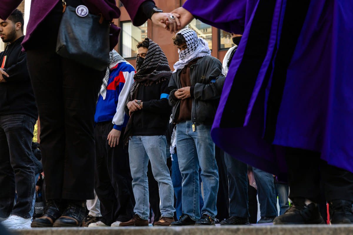 People pray as New York University students set up a tent encampment in Gould Plaza at NYU Stern School of Business on April 22, 2024.<span class="copyright">Michael M. Santiago—Getty Images</span>